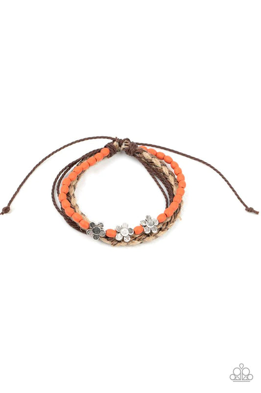 Three delightful etched silver flowers stand out on a strand of orange wooden beads. Paired with an assortment of braided twine and cording, the set wraps around the wrist for an earthy remix. Features an adjustable sliding knot closure.  Sold as one individual bracelet.