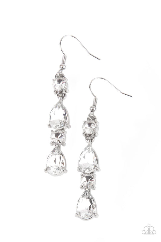 A glamorous collection of brilliant white teardrop and round rhinestones encased in classic silver pronged fittings stack together creating an irresistibly refined lure. Earring attaches to a standard fishhook fitting.  Sold as one pair of earrings.