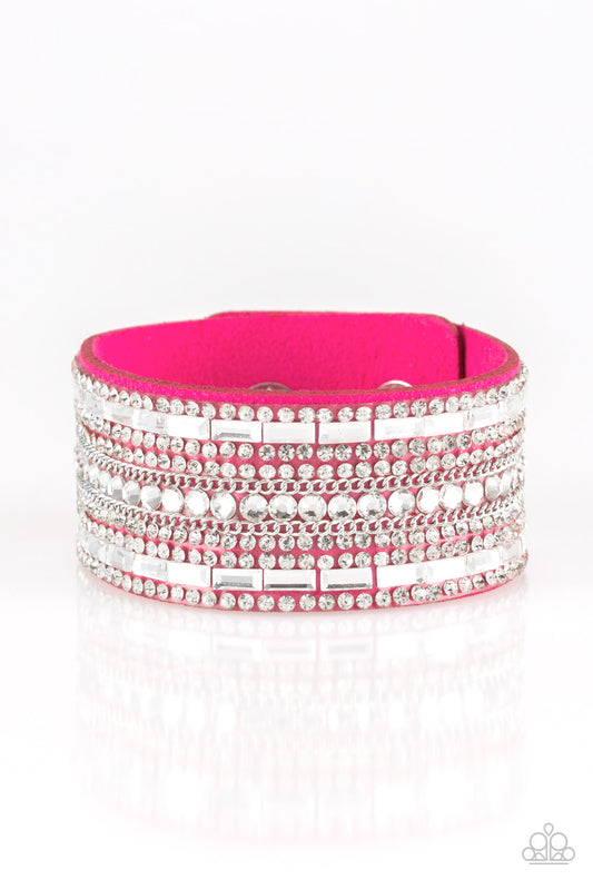 Featuring classic round and edgy emerald style cuts, glittery white rhinestones and glistening silver chains are encrusted along bands of pink suede for a sassy look. Features an adjustable snap closure.  Sold as one individual bracelet.