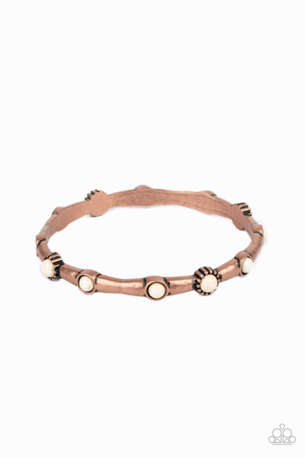 Dotted with dainty white stones, a hammered copper bangle glides along the wrist for a colorfully earthy look.  Sold as one individual bracelet.