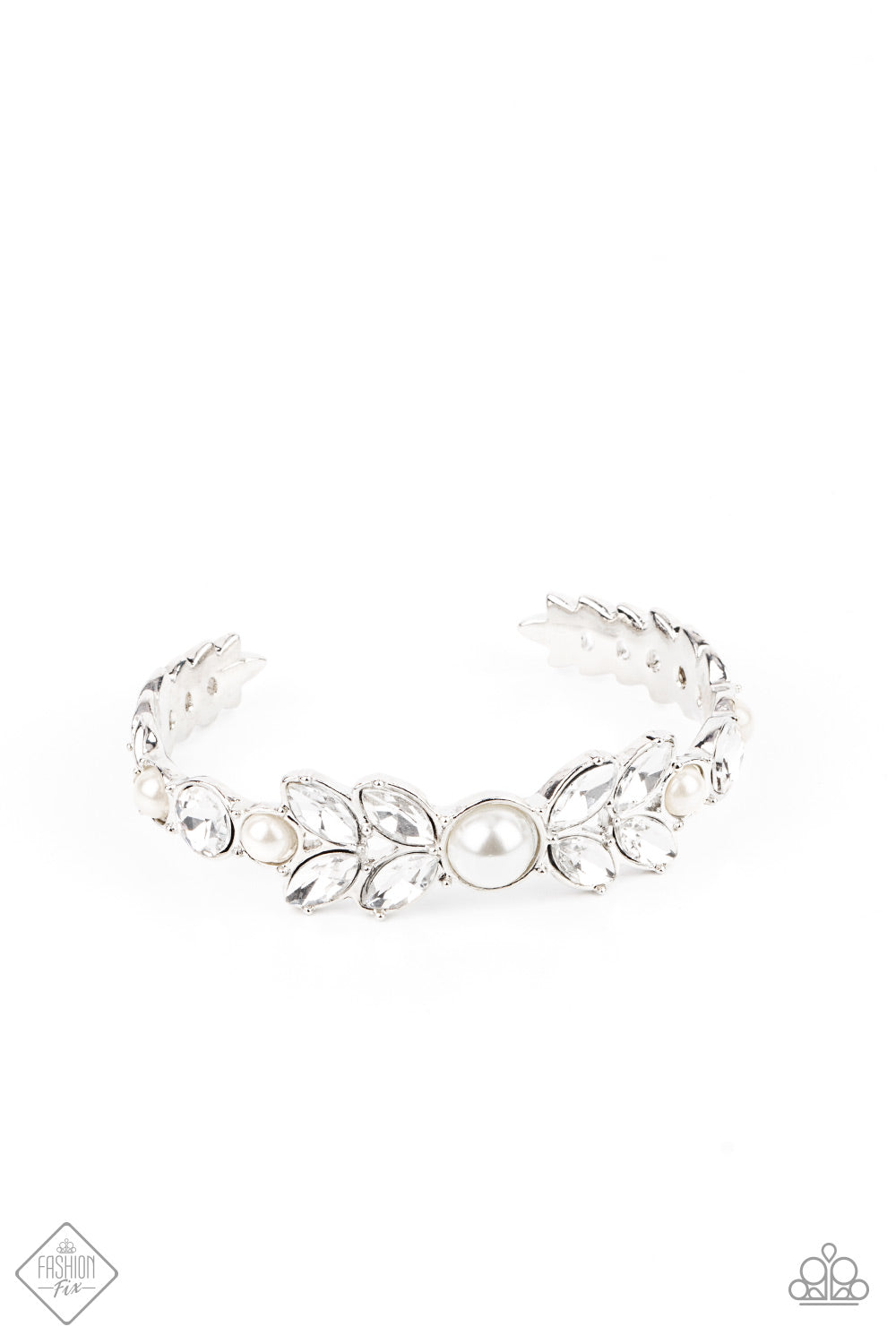 Dotted with bubbly white pearls, an oversized collection of round and marquise style white rhinestones boldly coalesce into a sparkly centerpiece that is flanked by stacks of leafy silver frames that gracefully curve into a decorative cuff.  Sold as one individual bracelet.