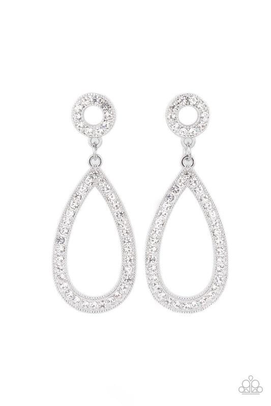 Dramatic and playful, alluring oversized teardrop frames are encrusted with countless brilliant white rhinestones. A smaller circle frame filled with the same shimmering white rhinestones gently anchors and balances the flirtatious look. Earring attaches to a standard post fitting.  Sold as one pair of post earrings.
