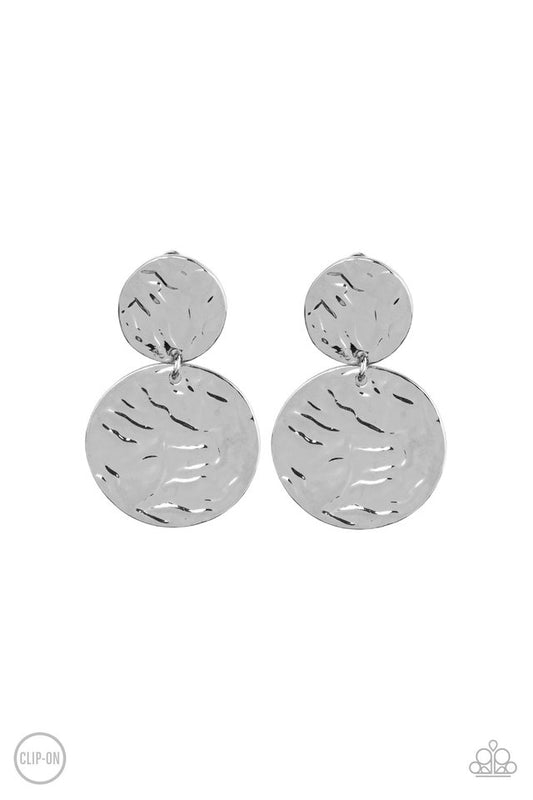 Varying in size, hammered silver discs link into a rippling lure. Earring attaches to a standard clip-on fitting.  Sold as one pair of clip-on earrings.