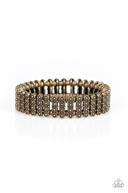 Dainty brass beads and stacked brass frames radiating with sunburst patterns are threaded along stretchy bands around the wrist for a whimsical look.

Sold as one individual bracelet.