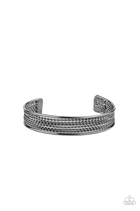 Sections of twisted gunmetal wires are bordered by two smooth gunmetal bars, coalescing into a bold industrial cuff around the wrist.  Sold as one individual bracelet.