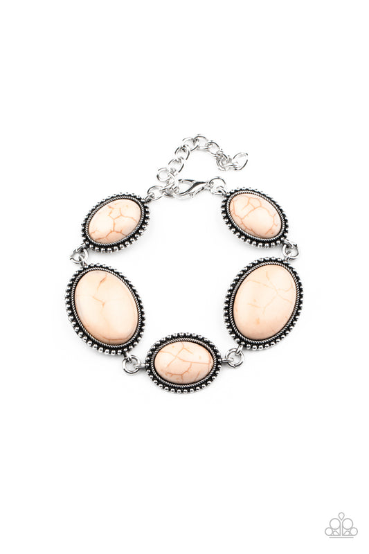 A collection of earthy brown oval stones are pressed into studded silver frames that delicately link across the wrist for a colorfully rustic look. Features an adjustable clasp closure.  Sold as one individual bracelet.