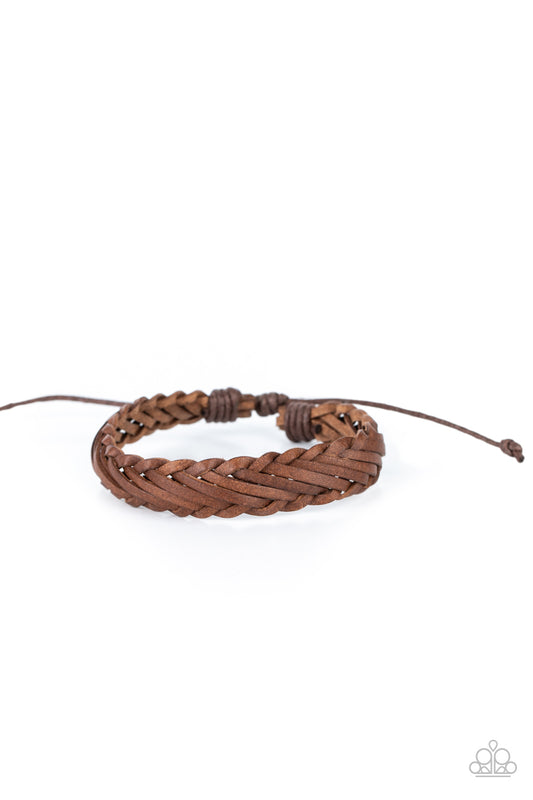 Rustic leather laces decoratively weave around the wrist, creating a rugged centerpiece. Features an adjustable sliding knot closure.  Sold as one individual bracelet.