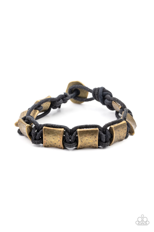 Featuring a hammered finish, a collection of rustic brass accents are knotted in place with black cording around the wrist for a rugged look. Features a button loop closure.  Sold as one individual bracelet.