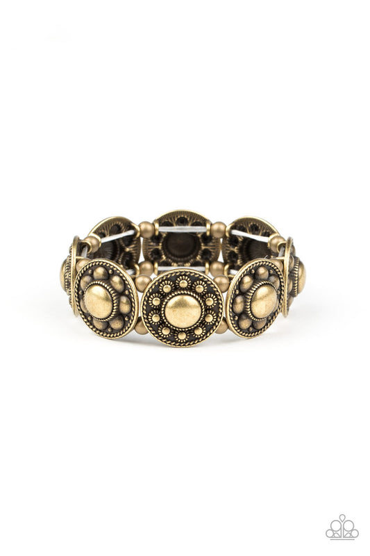 Studded and dotted in decorative floral patterns, antiqued brass frames are threaded along stretchy bands around the wrist for a seasonal flair.

Sold as one individual bracelet.
