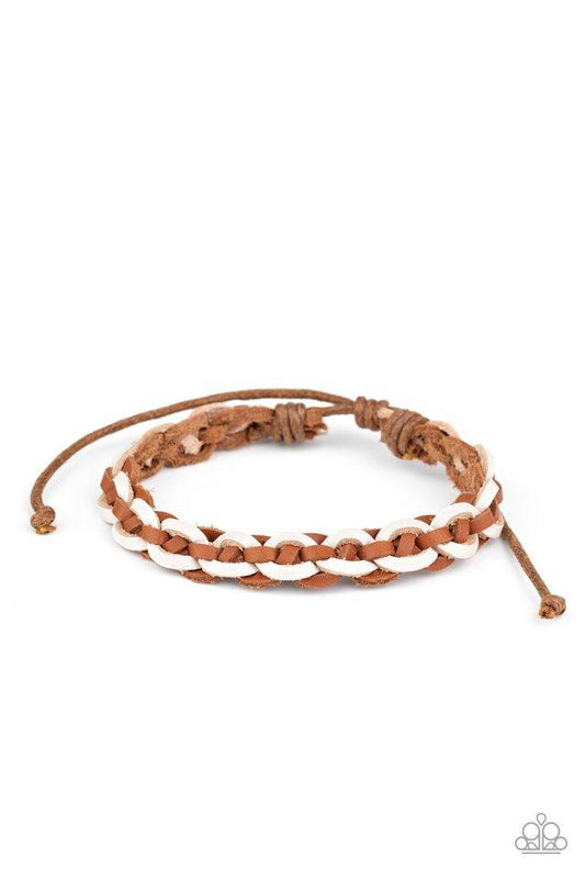 White and brown leather laces weave around the wrist, creating a rustic braid. Features an adjustable sliding knot closure.  Sold as one individual.