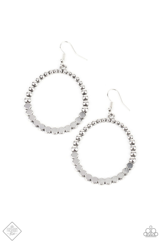 Antiqued silver studs join with flattened silver discs, creating a rustic front-facing hoop. Earring attaches to a standard fishhook fitting.  Sold as one pair of earrings.