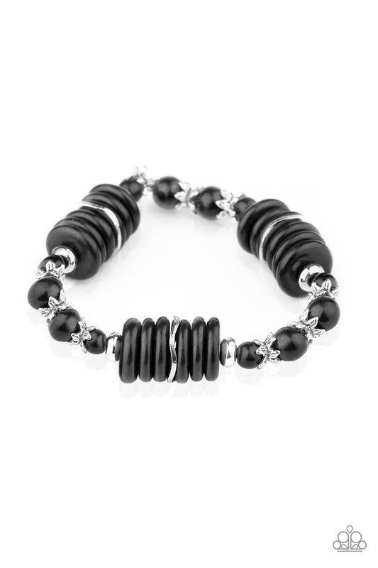 Featuring glistening silver accents, disc-shaped and round black stone beads are threaded along a stretchy band for a seasonal look.

Sold as one individual bracelet.