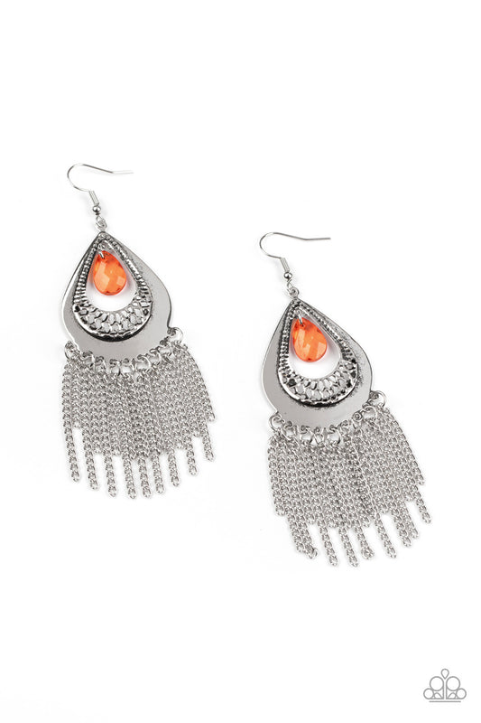 A faceted orange teardrop dangles from the top of a decorative silver teardrop frame featuring stenciled and hammered details. Dainty silver chains stream from the bottom, adding a classic fringe to the refined display. Earring attaches to a standard fishhook fitting.  Sold as one pair of earrings.
