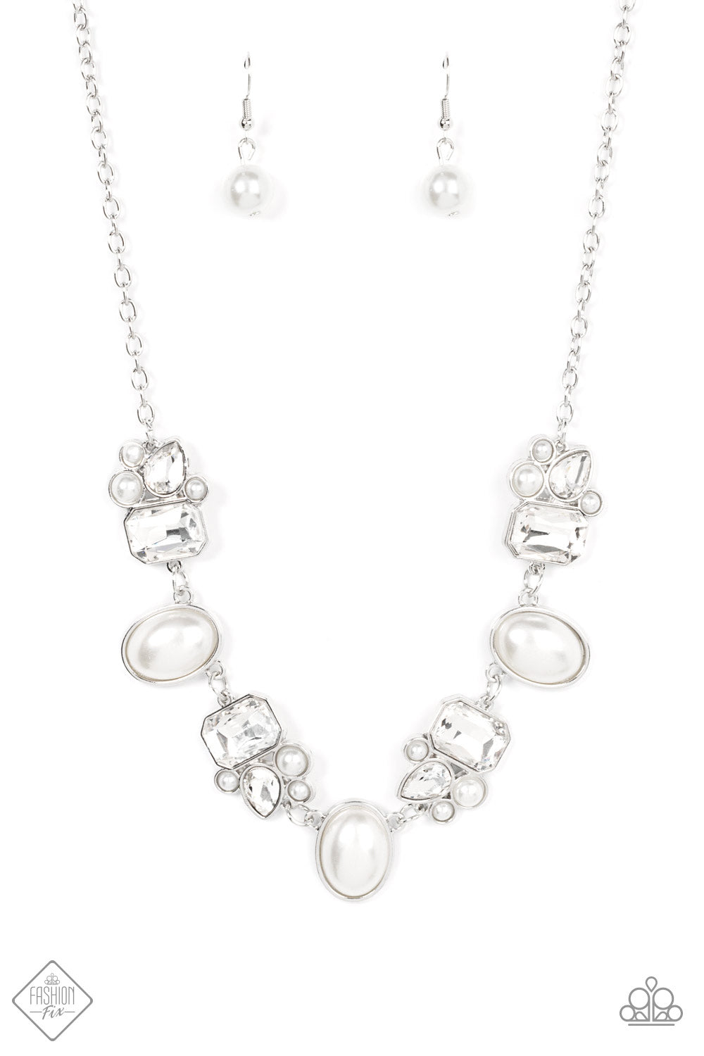 Swoon-worthy emerald cut and teardrop rhinestones, accented with bubbly pearl beads, coalesce into stunning asymmetrical frames. A trio of elegant white oval pearl beads alternates with the asymmetrical renditions, creating a sensational statement below the collar. Features an adjustable clasp closure.  Sold as one individual necklace. Includes one pair of matching earrings.