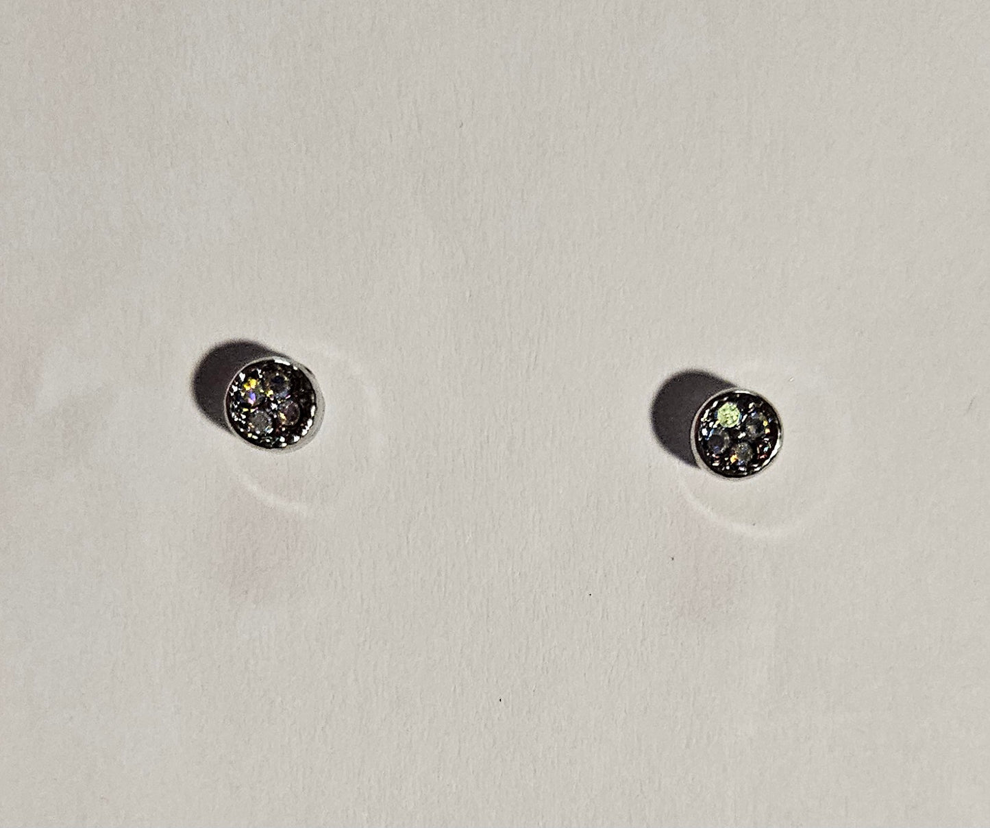 Kids' small silver cirlce earrings with a four small white rhinestones