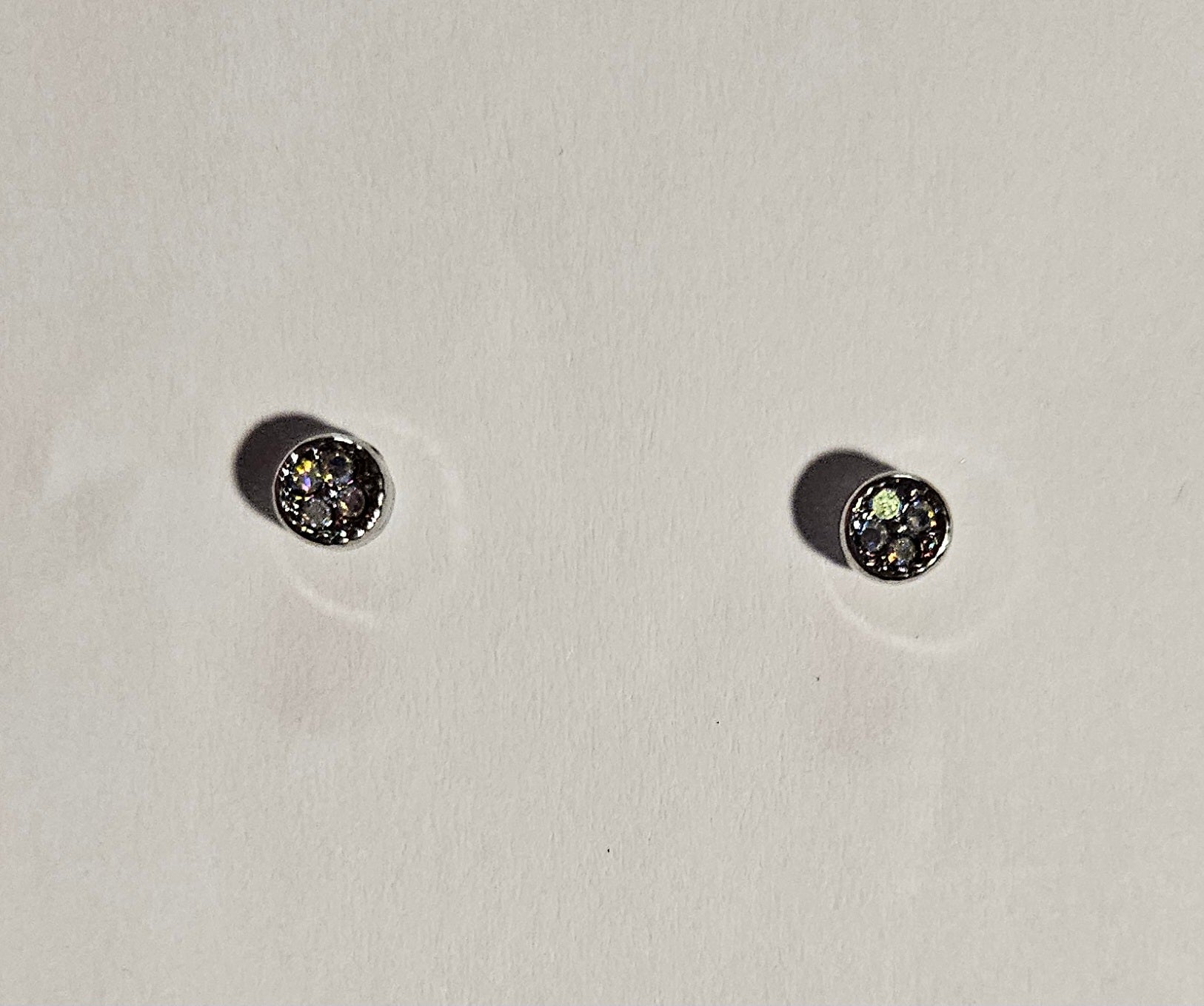 Kids' small silver cirlce earrings with a four small white rhinestones