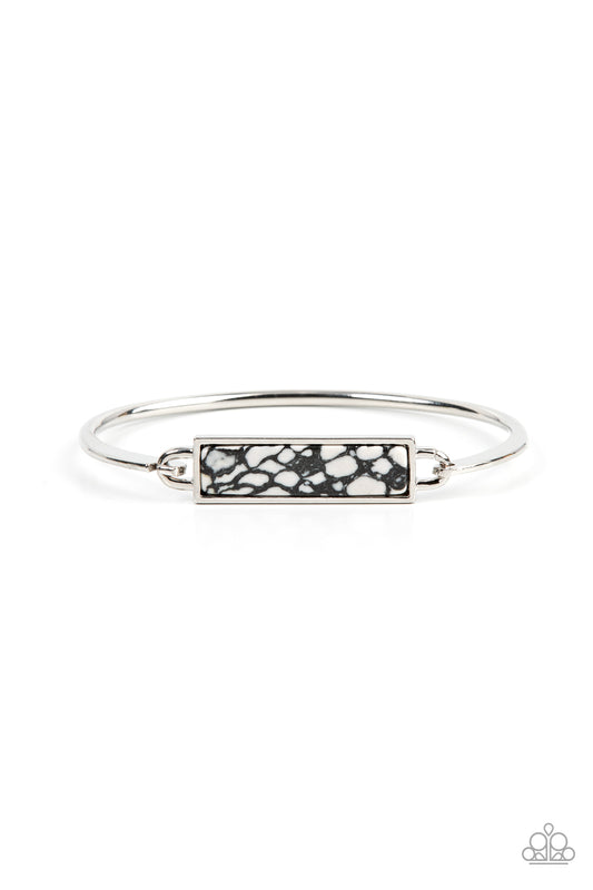Encased in a sleek silver frame, a black terrazzo-like stone frame is fitted in place across the center of a dainty silver bangle for a modern inspired fashion. Features a hook and eye closure.

Sold as one individual bracelet.