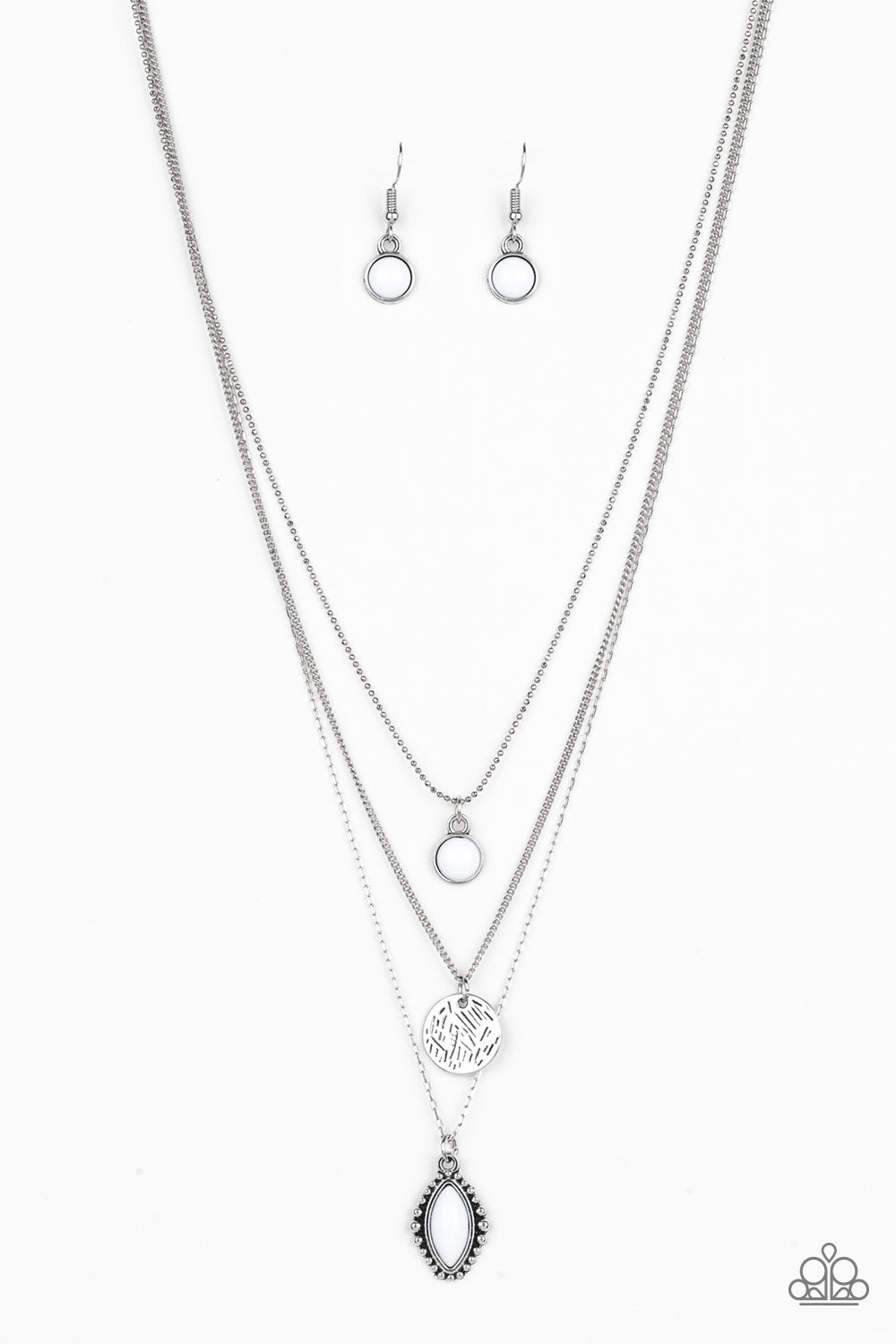 Three mismatched silver chains layer below the collar. A round white bead swings from the uppermost chain, above a scratched silver disc, and marquise-shaped white bead for a colorfully layered look. Features an adjustable clasp closure.  Sold as one individual necklace. Includes one pair of matching earrings.