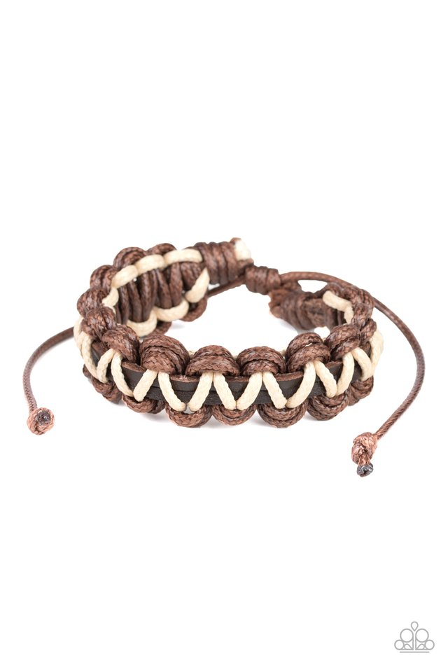 Strands of brown and white cording ornately weave around brown leather cords, creating an earthy braid. Features an adjustable sliding knot closure.  Sold as one individual bracelet.