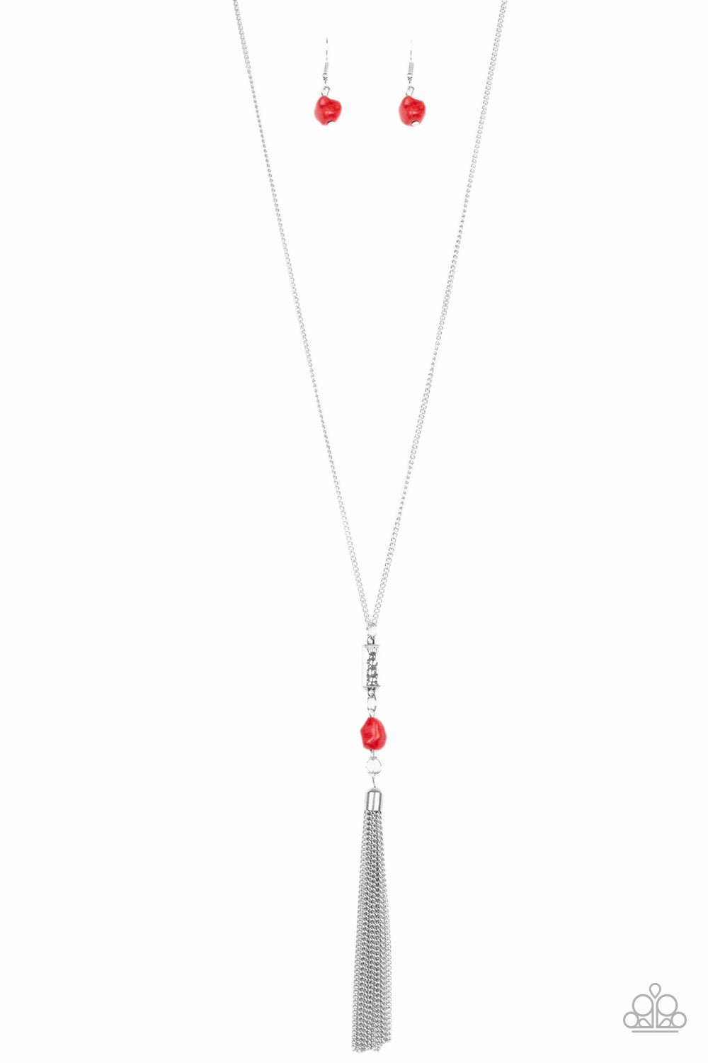 Infused with a lengthened silver chain, a shimmery silver tassel swings from the bottom of a stacked red stone and hammered silver frame for a seasonal look. Features an adjustable clasp closure.  Sold as one individual necklace. Includes one pair of matching earrings.