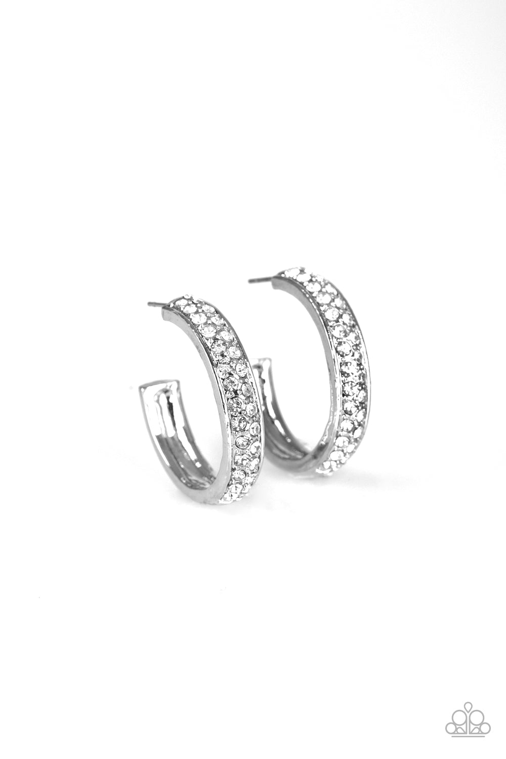 The front half of a thick silver hoop is encrusted in dazzling white rhinestones for a flawless look. Earring attaches to a standard post fitting. Hoop measures 1" in diameter.  Sold as one pair of hoop earrings.