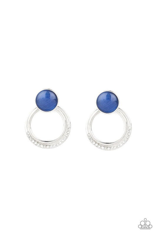 A plain silver hoop and white rhinestone encrusted hoop swing from the bottom of a glowing blue cat's eye stone fitting for a whimsical fashion. Earring attaches to a standard post fitting.  Sold as one pair of post earrings.