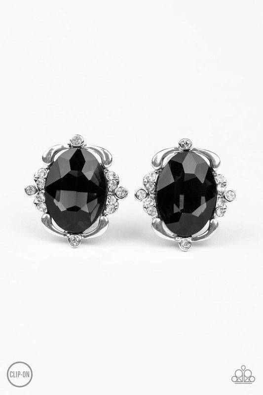 Sporadically dotted in sections of glassy white rhinestones, shimmery ribbons of silver gently fold around a dazzling black emerald-style gem center for a regal look. Earring attaches to a standard clip-on fitting.  Sold as one pair of clip-on earrings.