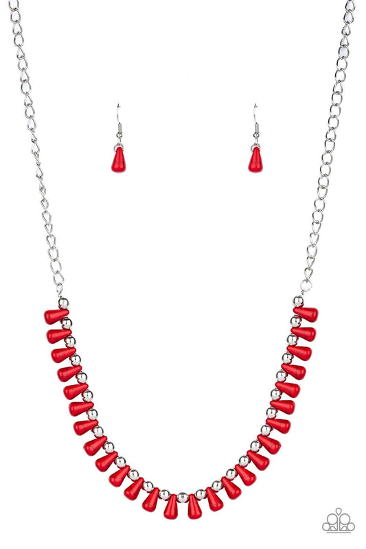 Red teardrop stones and classic silver beads are threaded along an invisible wire. The earthy beads alternate below the collar, creating a wild fringe. Features an adjustable clasp closure.  Sold as one individual necklace. Includes one pair of matching earrings.