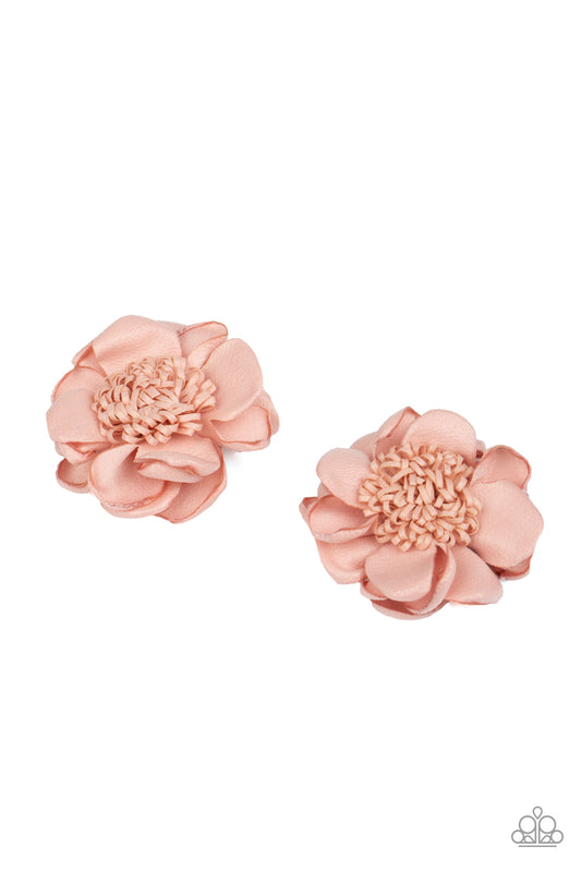 Waxy pink petals bloom from a springy center, creating a charming pair of colorful blossoms. Each flower features a standard hair clip on the back.  Sold as one pair of hair clips.