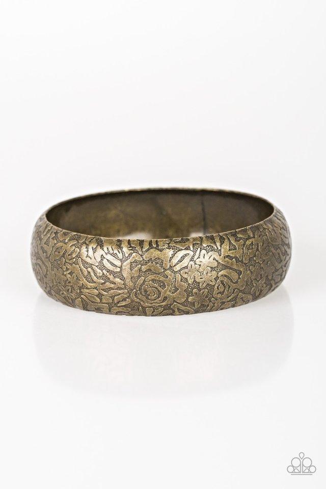 Brushed in an antiqued finish, a rosy floral pattern is embossed across a thick brass bangle for a seasonal flair.  Sold as one individual bracelet.