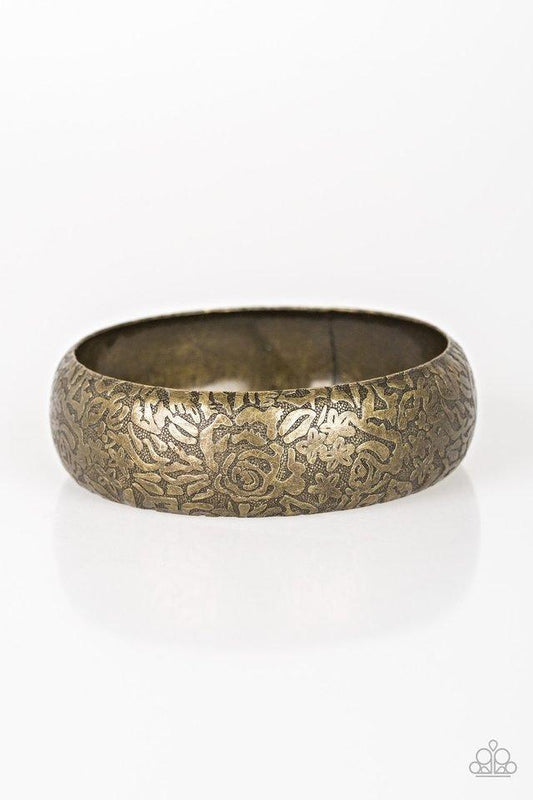 Brushed in an antiqued finish, a rosy floral pattern is embossed across a thick brass bangle for a seasonal flair.  Sold as one individual bracelet.