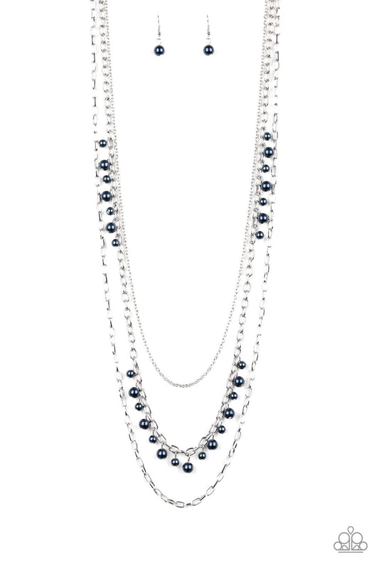 Three mismatched silver chains layer down the chest. Dainty blue pearls cascade down one silver chain, adding a flirty twist to the timeless pearl palette. Features an adjustable clasp closure.  Sold as one individual necklace. Includes one pair of matching earrings.