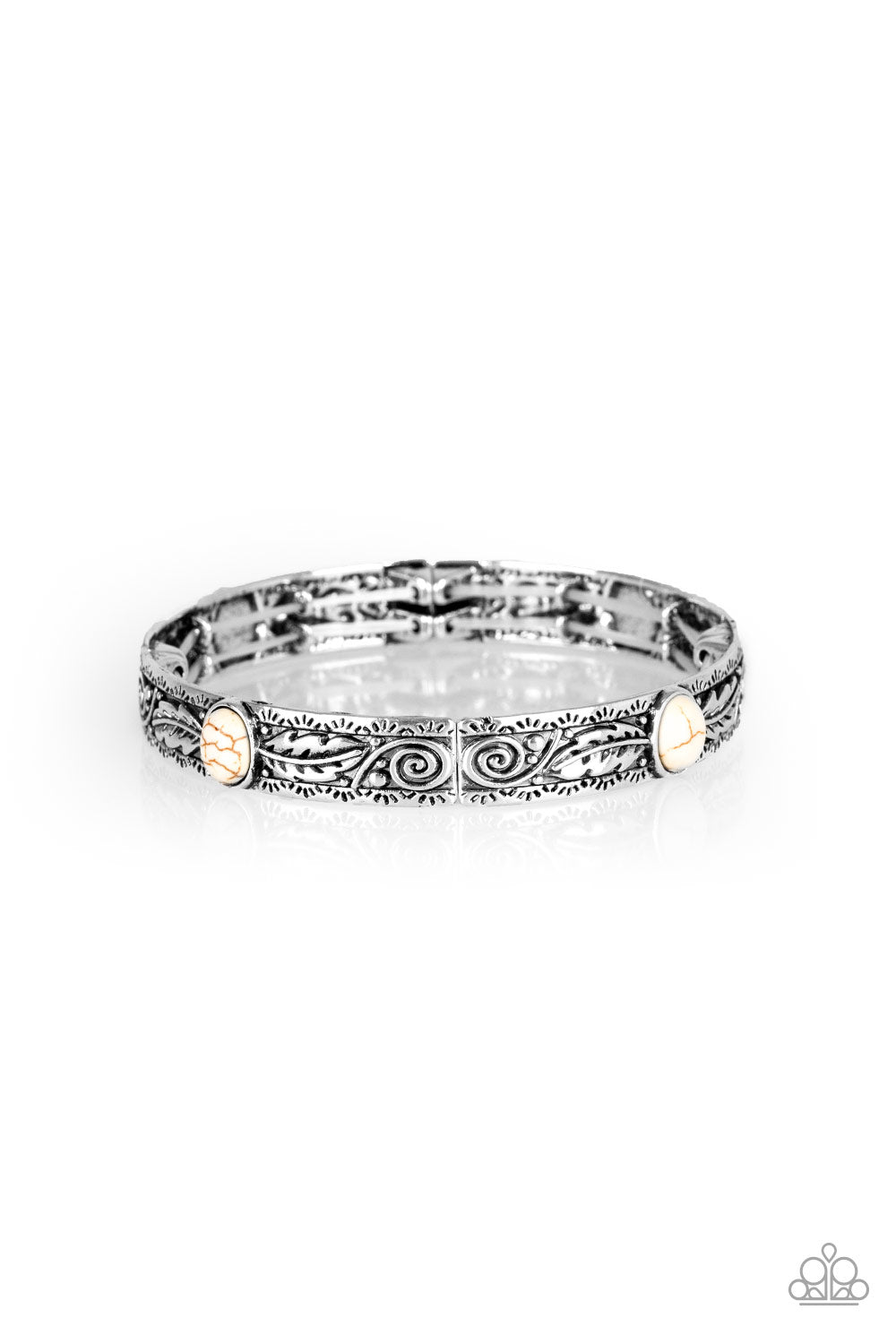 Embossed in swirling silver and feather like detail, antiqued silver frames are threaded along stretchy bands around the wrist. Refreshing white stones adorn the centers of the Southwestern frames for a seasonal finish.  Sold as one individual bracelet.