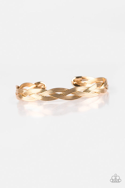 Glistening gold wires braid across the wrist, coalescing into a dainty cuff.  Sold as one individual bracelet.