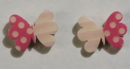 Colorful earrings in assorted colors and shapes. Featuring one striped and one polka dotted wing, the colorful butterfly frames vary in shades of pink. Earrings attach to standard post fittings.  Sold as one pair of post earrings.