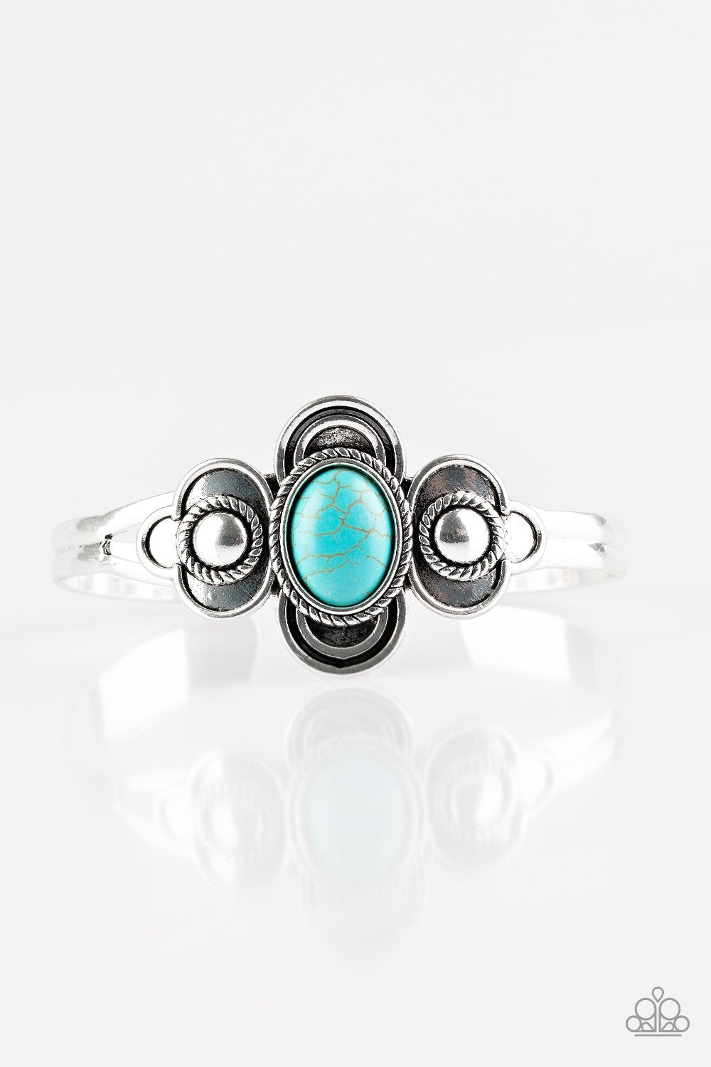 A refreshing turquoise stone is pressed into the center of a dainty silver cuff radiating with textured silver frames for a seasonal look.  Sold as one individual bracelet.