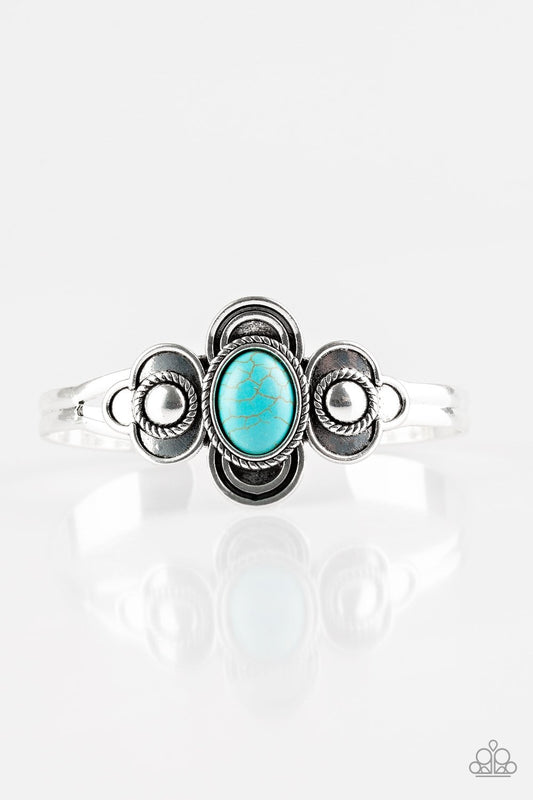 A refreshing turquoise stone is pressed into the center of a dainty silver cuff radiating with textured silver frames for a seasonal look.  Sold as one individual bracelet.