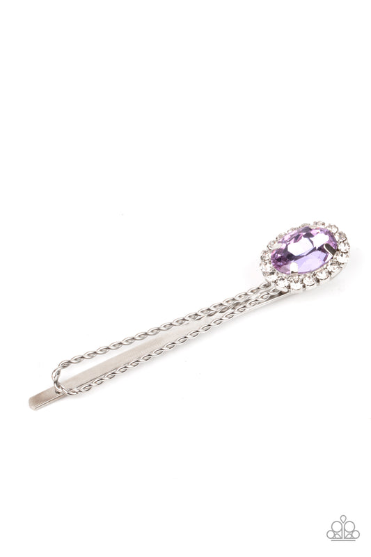 Bordered in a ring of glassy white rhinestones, an oval purple gem adorns the corner of a textured silver bobby pin for a glamorous finish.  Sold as one individual decorative bobby pin.