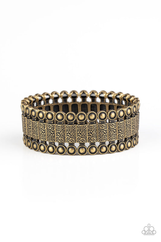 Featuring studded and hammered pieces, decorative rectangular-shaped brass frames are threaded along stretchy bands around the wrist for an authentic look.  Sold as one individual bracelet.