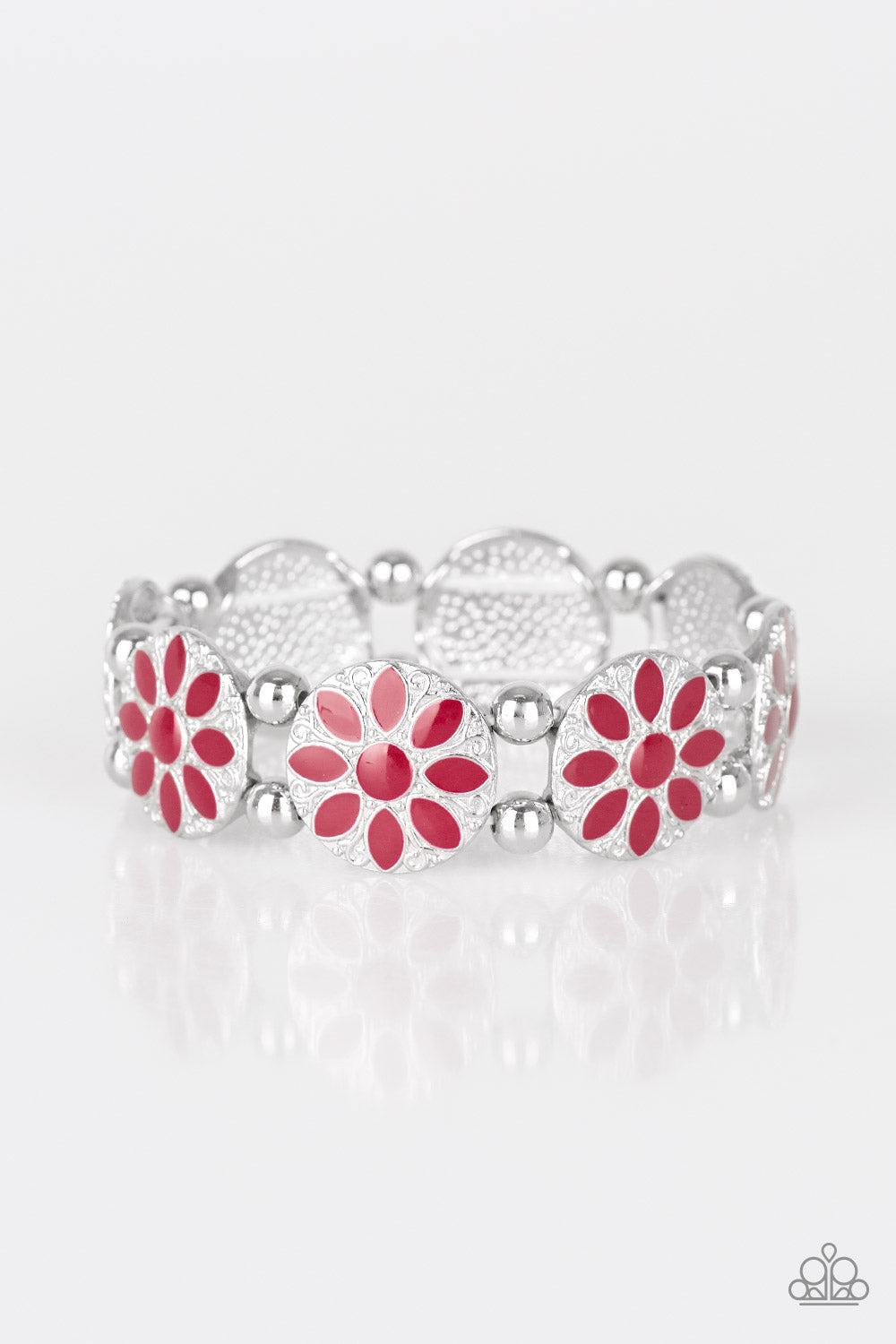 Painted in a rich red finish, ornate silver floral frames are threaded along a stretchy band across the wrist for a seasonal look.  Sold as one individual bracelet.