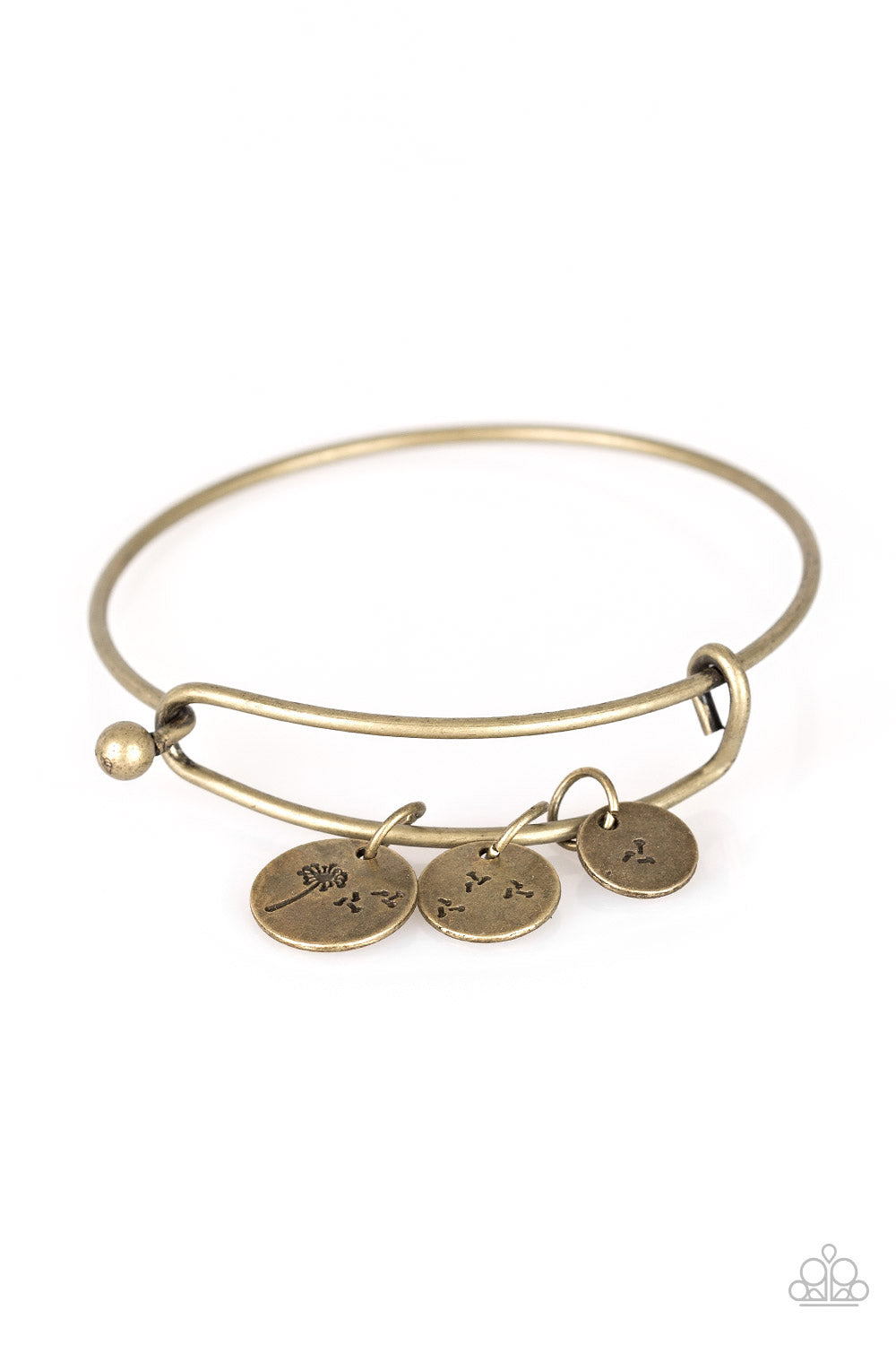 Stamped in dandelion patterns, glistening brass charms featuring floral patterns slide along a sleek bar fitting for a whimsical look. Features a toggle closure.  Sold as one individual bracelet.