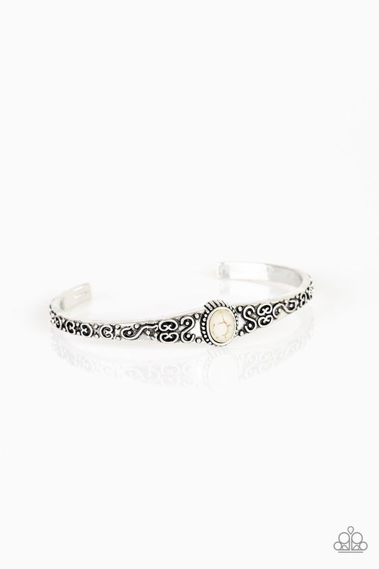Infused with a refreshing white stone center, a dainty silver cuff has been embossed in swirling antiqued detail for a seasonal look.  Sold as one individual bracelet.