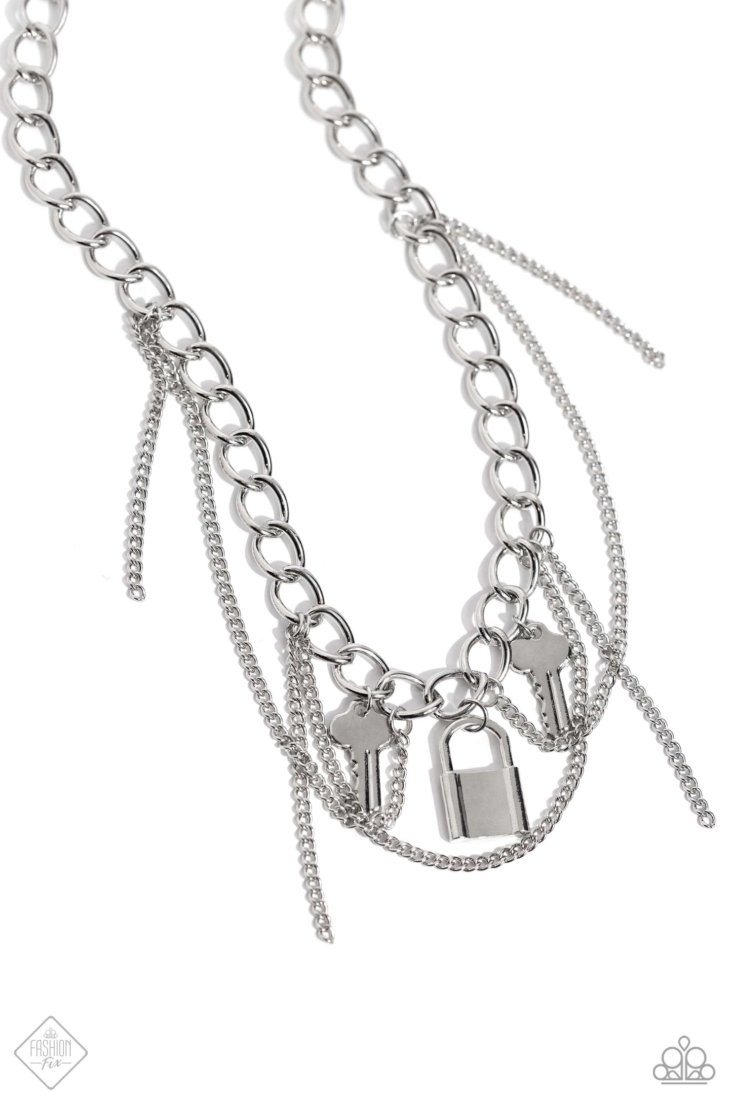 Mismatched silver chains layer down the chest. Featuring a high-metallic sheen, two key charms and a silver lock charm dangle from the upper-most chain while solitaire strands of silver chain sporadically swing and loop through the display, infusing the design with grungy movement. Features an adjustable clasp closure.  Sold as one individual necklace. Includes one pair of matching earrings.