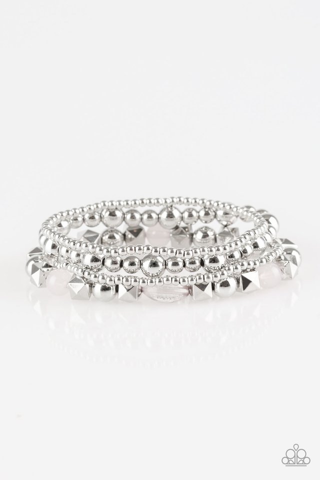 Mismatched silver beads and glassy silver beads are threaded along stretchy bands, creating colorful layers across the wrist.

Sold as one set of four bracelets.