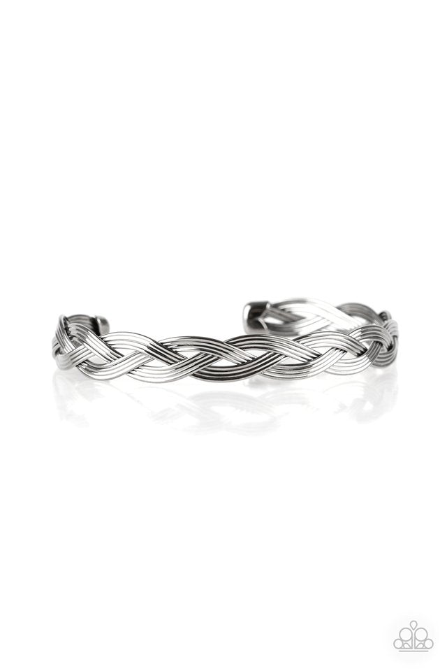 Glistening gunmetal wires braid across the wrist, coalescing into a dainty cuff.  Sold as one individual bracelet.