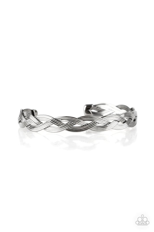 Glistening gunmetal wires braid across the wrist, coalescing into a dainty cuff.  Sold as one individual bracelet.