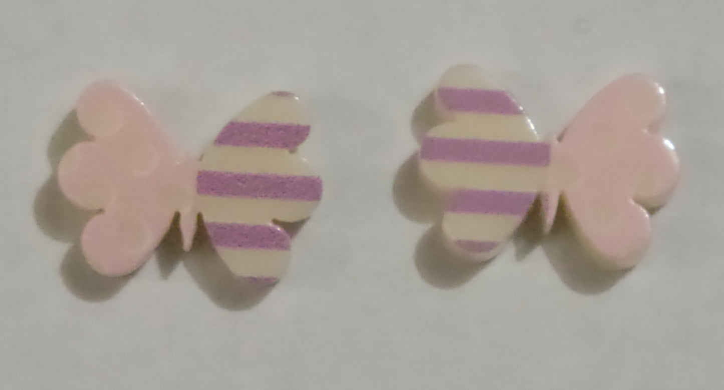 Colorful earrings in assorted colors and shapes. Featuring one striped and one polka dotted wing, the colorful butterfly frames vary in shades of pink and purple stripes. Earrings attach to standard post fittings.  Sold as one pair of post earrings.
