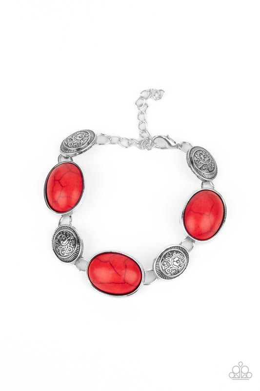A whimsical collection of fiery red stones and floral embossed silver frames delicately link around the wrist for a seasonal flair. Features an adjustable clasp closure.  Sold as one individual bracelet.