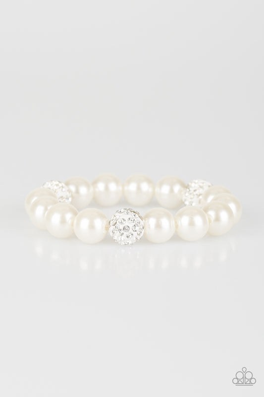 A collection of white pearls and white rhinestone encrusted beads are threaded along a stretchy band around the wrist for a refined flair.

Sold as one individual bracelet.