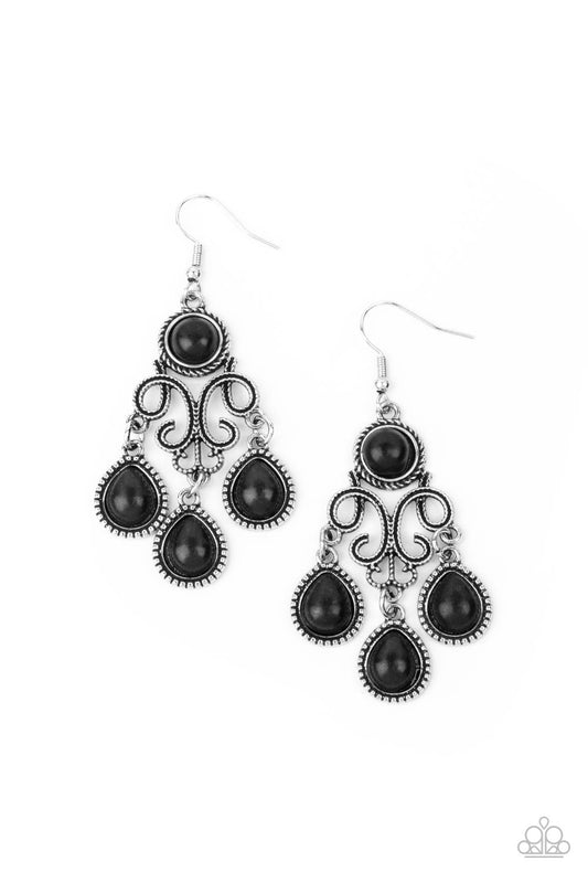 Earthy black stone dotted frames swing from the bottom of a filigree filled chandelier dotted with a matching black stone, creating an earthy fringe. Earring attaches to a standard fishhook fitting.  Sold as one pair of earrings.